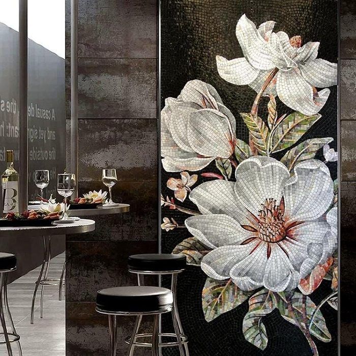 White magnolia blossom mosaic mural on a black background in a dark luxury bar interior
